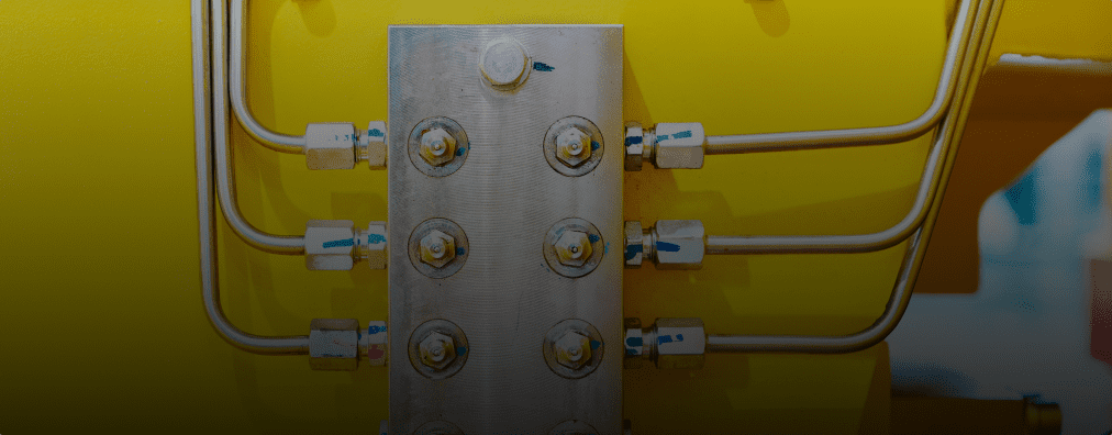 Close-up of a hydraulic directional control valve, highlighting the machine's gears and internal mechanisms.