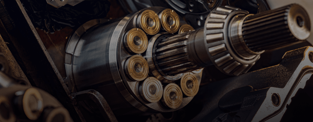 A close-up view of a hydraulic pump showcasing intricate gears and mechanisms for repair purposes.